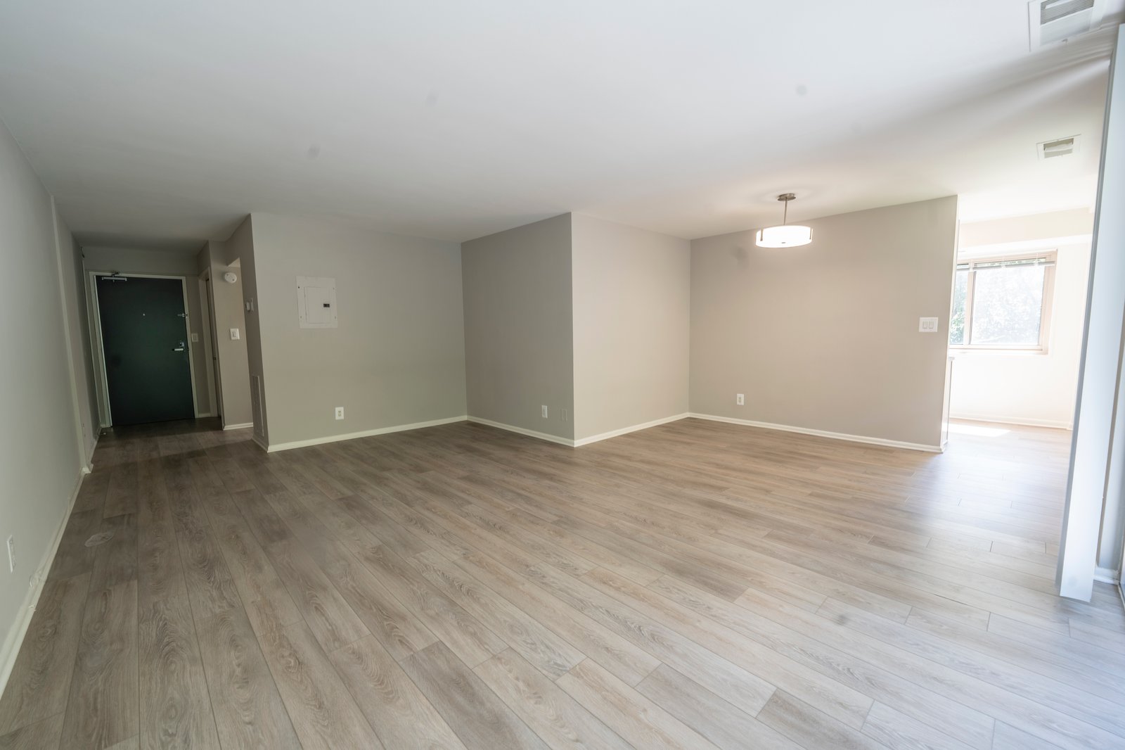 Empty living and dining room before virtual staging